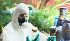 Worker examining bottle